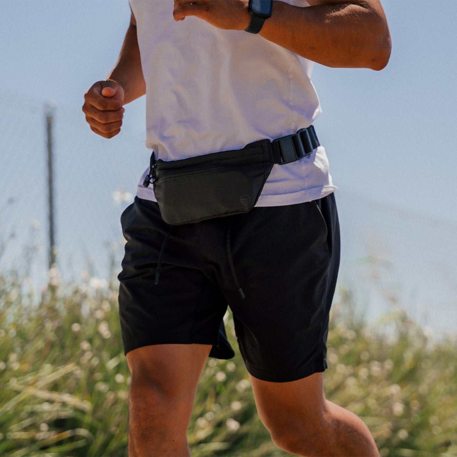 Black Runner Sling worn by a man while running.