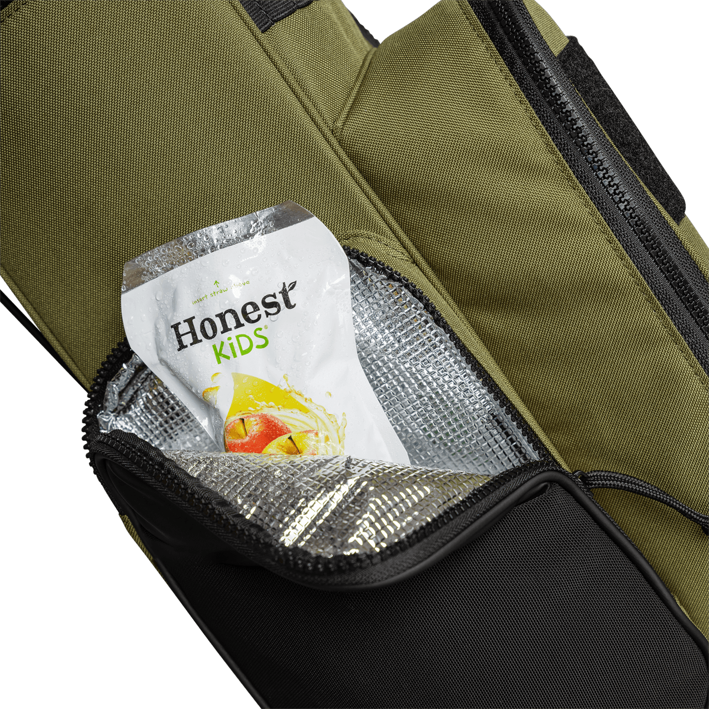 A close up shot of a Patton Green Recess kids golf bag's insulated pocket with a canned drink inside