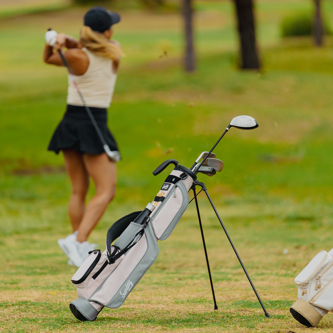 woman golfing with sunday golf loma bag in pink flamingo color