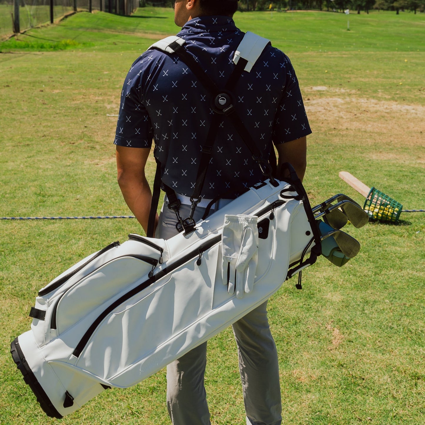 Back view of a man wearing the Ryder White S Class, highlighting the bag and the double straps