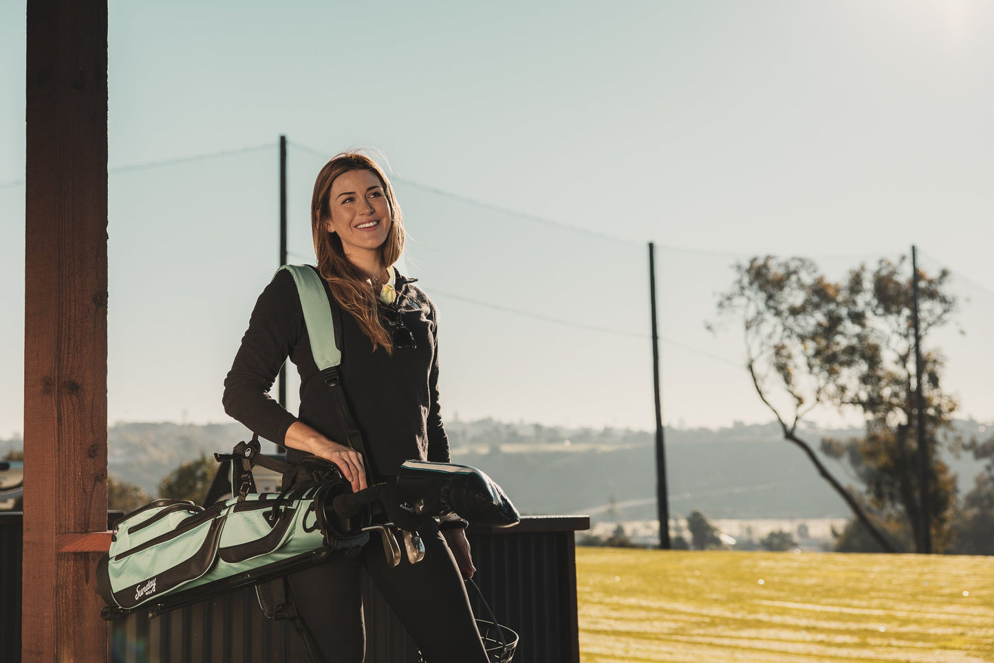 woman with seafoam loma xl golf bag