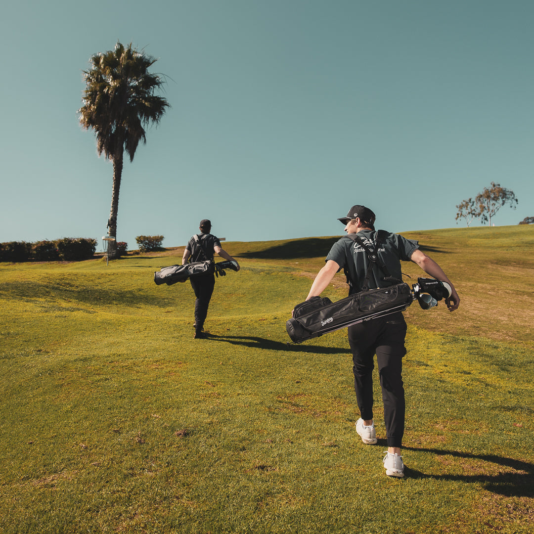 two men carrying Loma XL Bags by Sunday Golf on the golf course