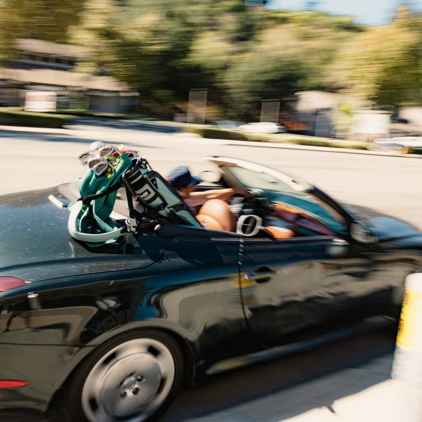 man driving away with seafoam loma xl golf bag