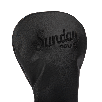 Close up shot of driver golf headcover in black vegan leather showing its material and Sunday Golf logo
