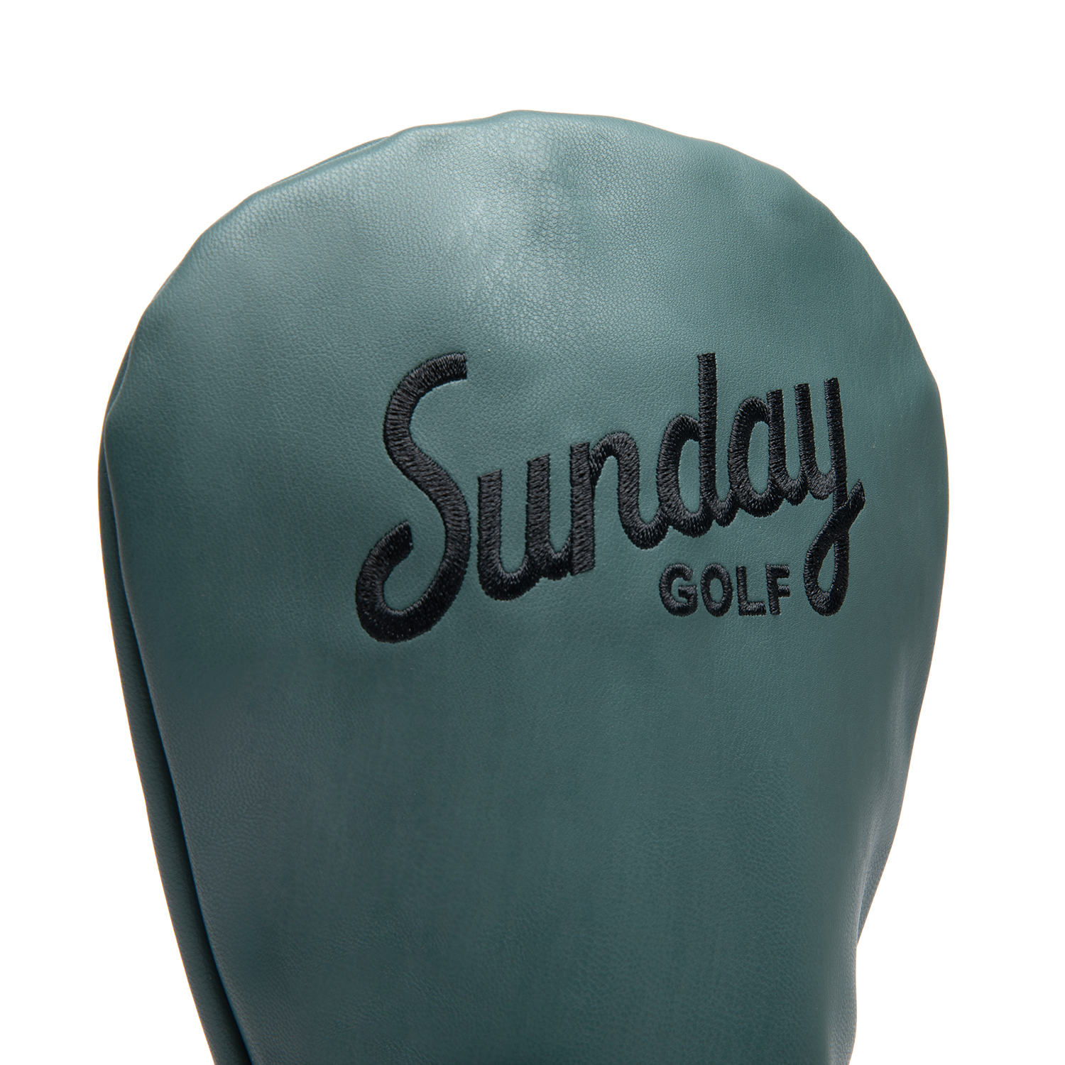 Close up shot of driver golf headcover in midnight green vegan leather showing its material and Sunday Golf logo
