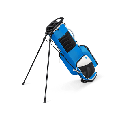 A full shot of a blue & white Recess kids golf bag facing backward
