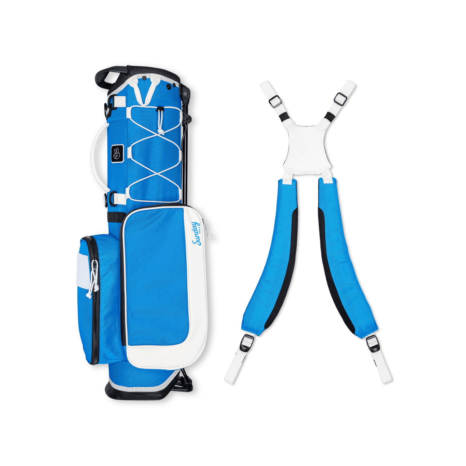 A full shot of a blue & white Recess kids golf bag laying flat sideways beside its double straps
