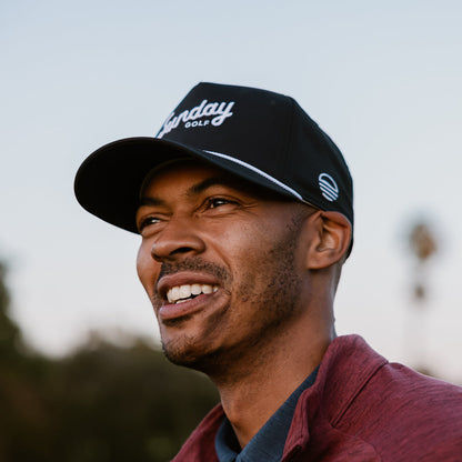 man wearing black rope hat by sunday golf