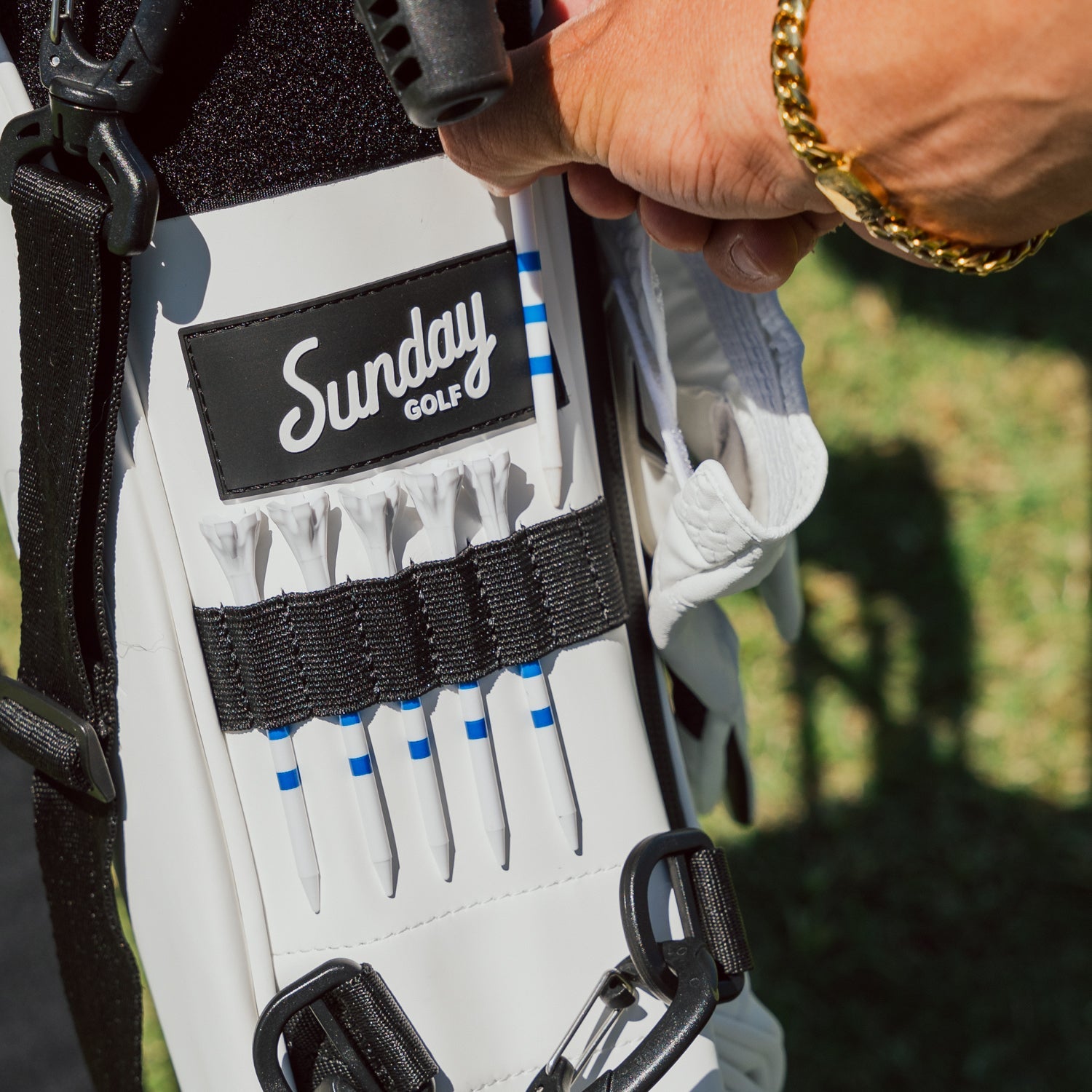 Loma XL S Class White detailed shot on the molle tee webbing and some tees in it