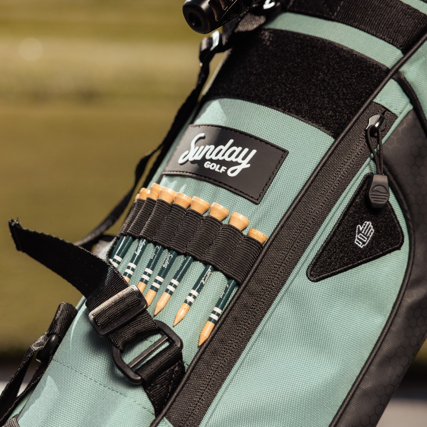 golf tees on seafoam sunday golf bag